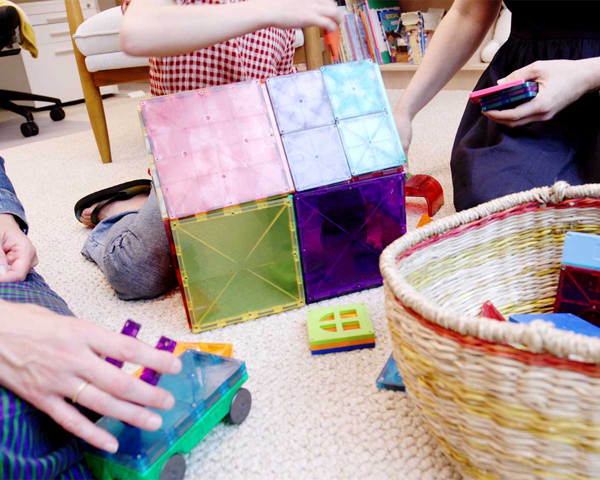 Children using magnetic construction toys during a play-based therapy session at HeartSoundMind Consulting.
