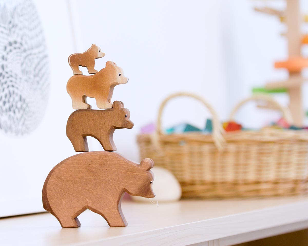 Wooden bear stacking toys displayed in the welcoming therapy space at HeartSoundMind Consulting.